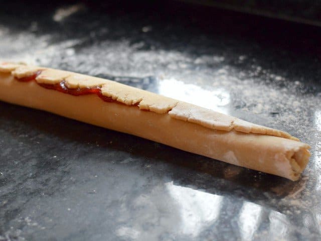 Roll rectangle into a log before cutting into pinwheels