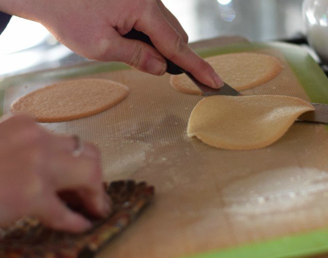 Slide an offset spatula under the baked fortune cookie