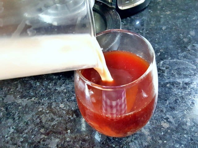 Add frothed cream to chocolate cherry latte