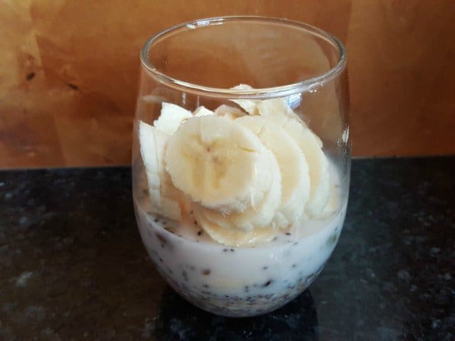 Add sliced banana to homemade gluten free cereal and milk