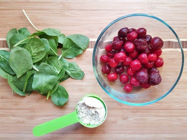 Cherries spinach and protein powder for a smoothie bowl recipe