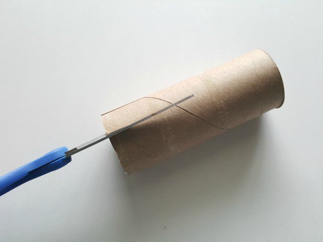 Cut one inch slits in cardboard tube