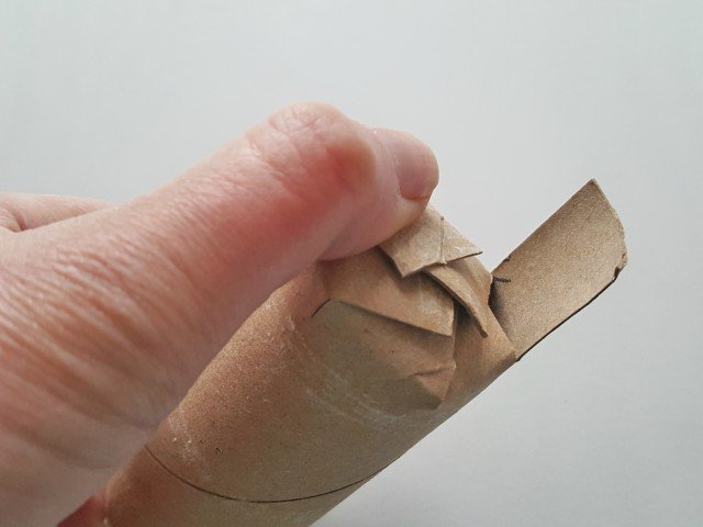 Fold slats to make a seal on one end of the tube