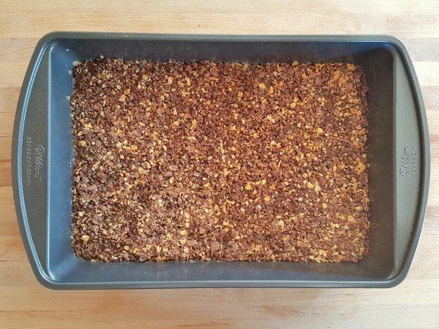press cereal into butter in even layer