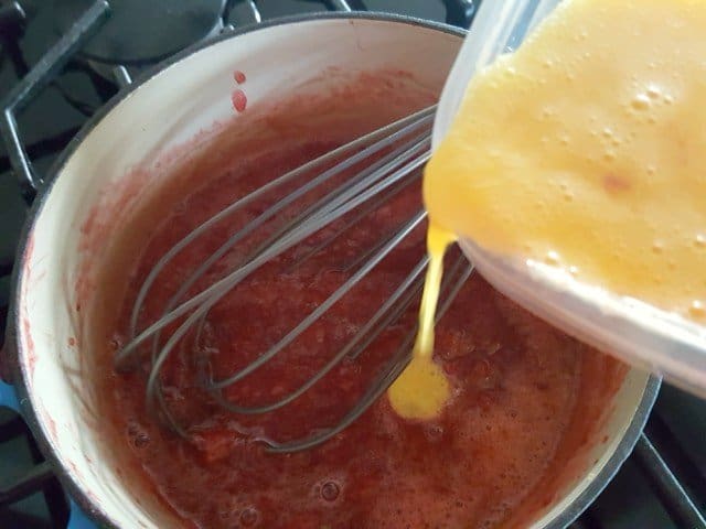 Add eggs to homemade strawberry curd strawberry curd
