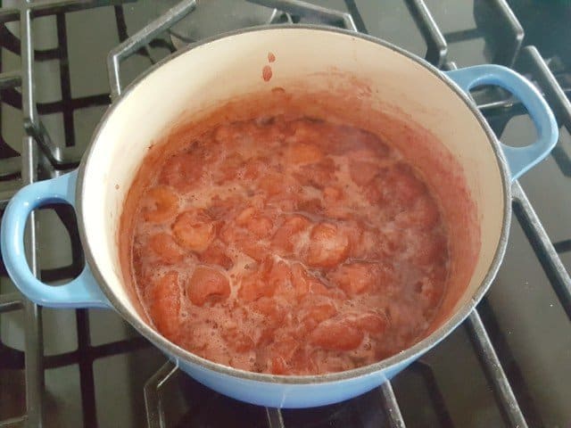 Heat ingredients for strawberry curd