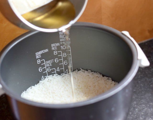 Add cooled vinegar to rice