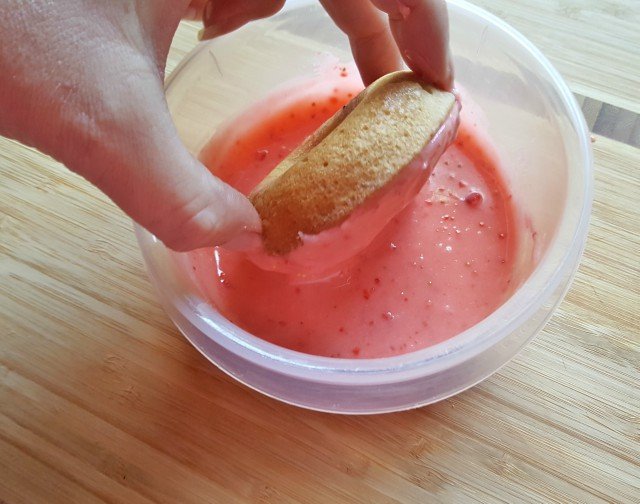 Dunk cooled strawberry donuts in strawberry lemonade glaze