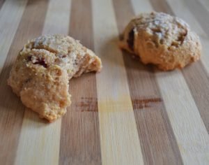 Taking a bite of cherry yogurt breakfast cookies