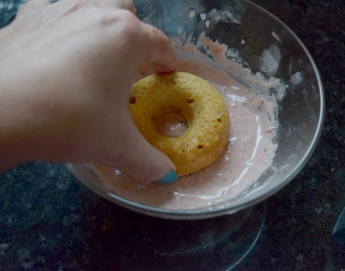 Dip donuts and twist from glaze to remove