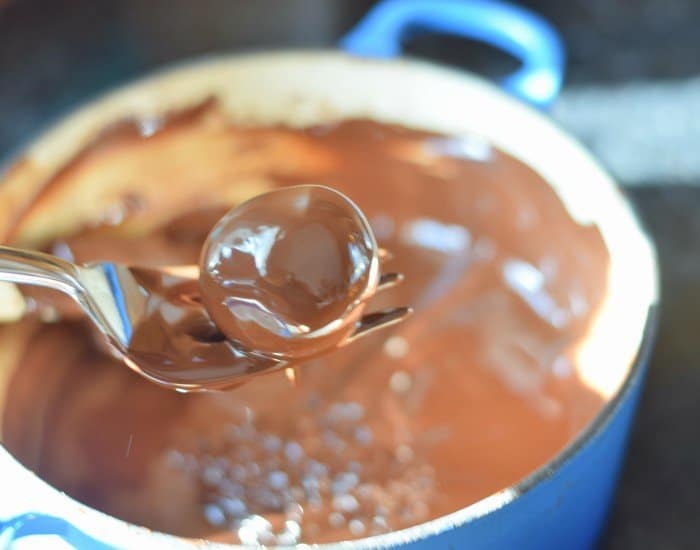 Shake off excess chocolate