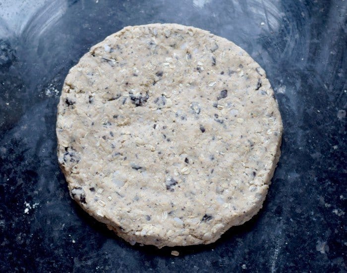 Pat cherry chip scones dough into a circle