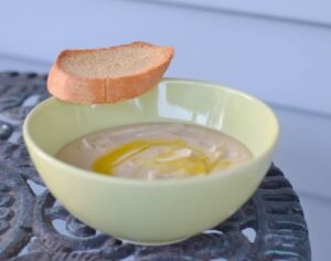 Bowl of gluten free Tuscan bean soup with crostini