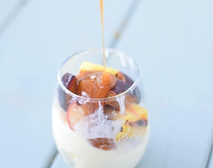 Add brown sugar caramel sauce to grilled fruit sundae