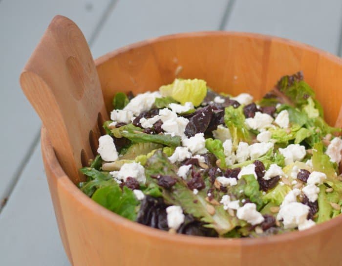 Simple summer salad for potluck with goat cheese and dried cherries