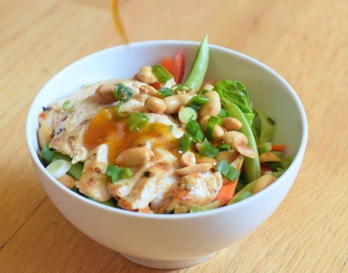 Bowl of homemade kung pao chicken salad with PF changs sauce