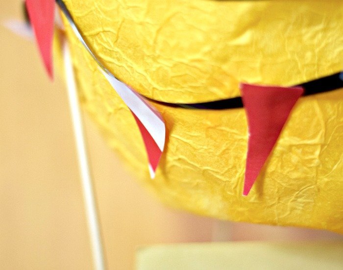 Add bunting to papier mache hot air balloon
