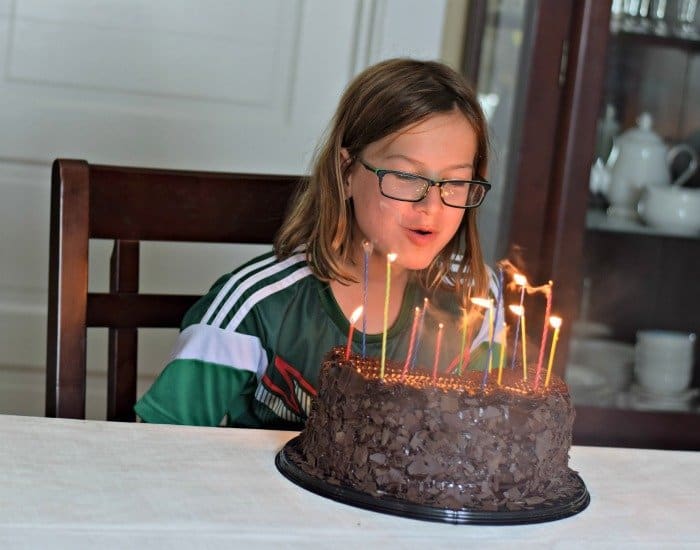 Blowing out candles on the huge cake