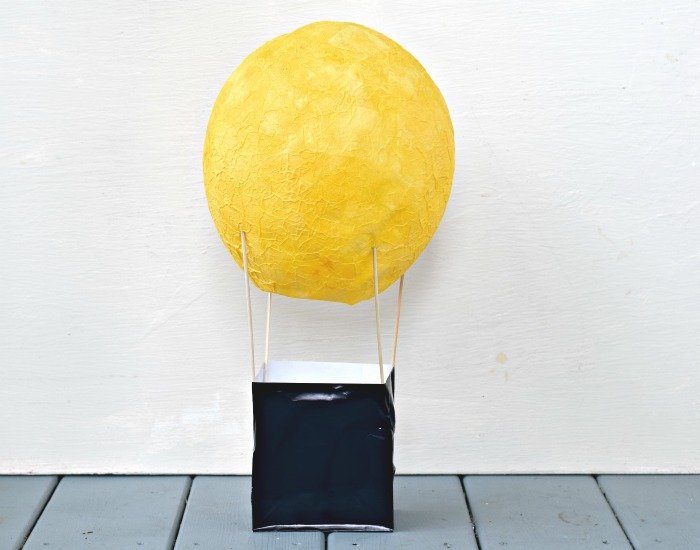 DIY hot air balloon centerpiece partially assembled