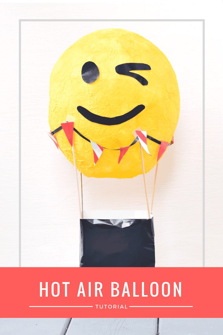 Make this fun paper mache DIY hot air balloon centerpiece for your next emoji kids birthday party. This tutorial shows you how to make this emoji hot air balloon for a fun centerpiece or to hold cards so they don't get lost.