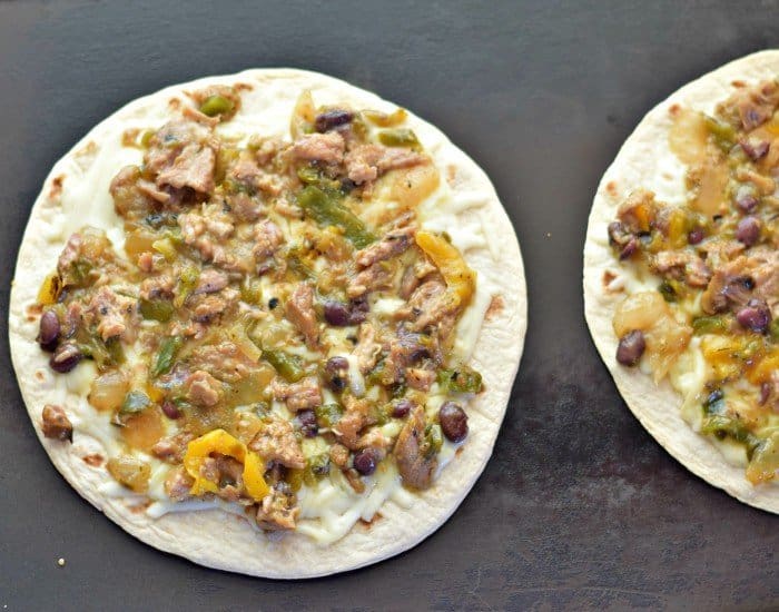 Add Frontera carnitas skillet over cheese layer