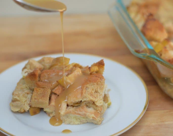 Pour caramel sauce over apple bread pudding