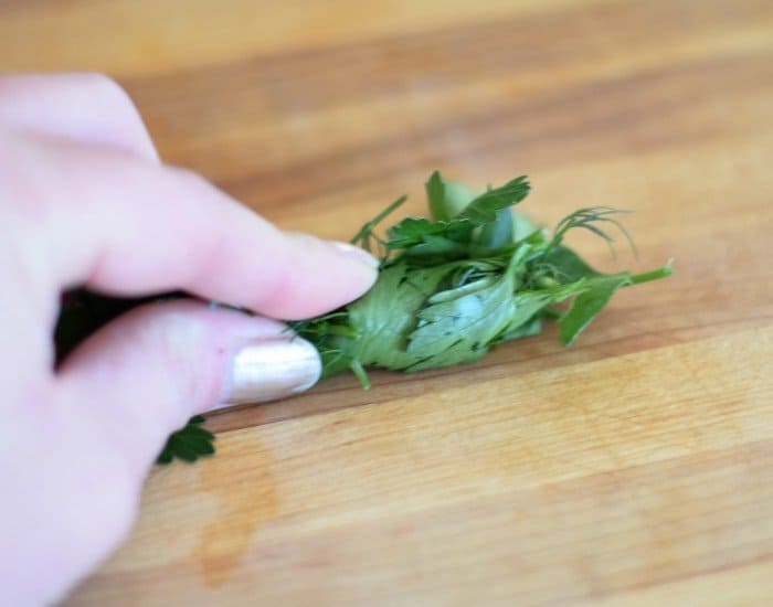 Roll herbs into a log then slice