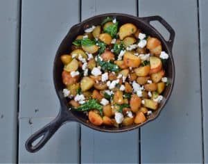 Skillet roasted potatoes with garlic and spinach