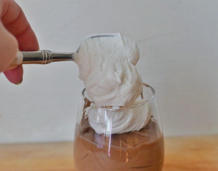 Add whipped cream to boozy chocolate mousse