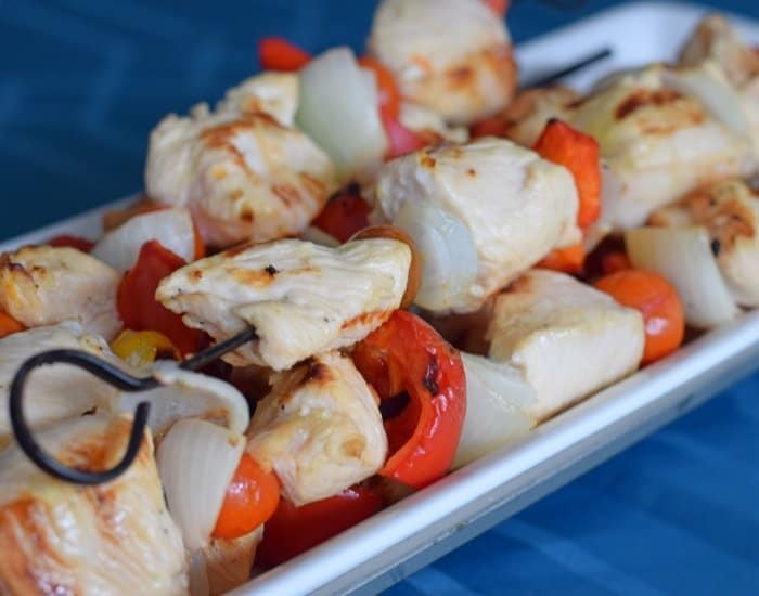 Platter of lemon chicken kebabs