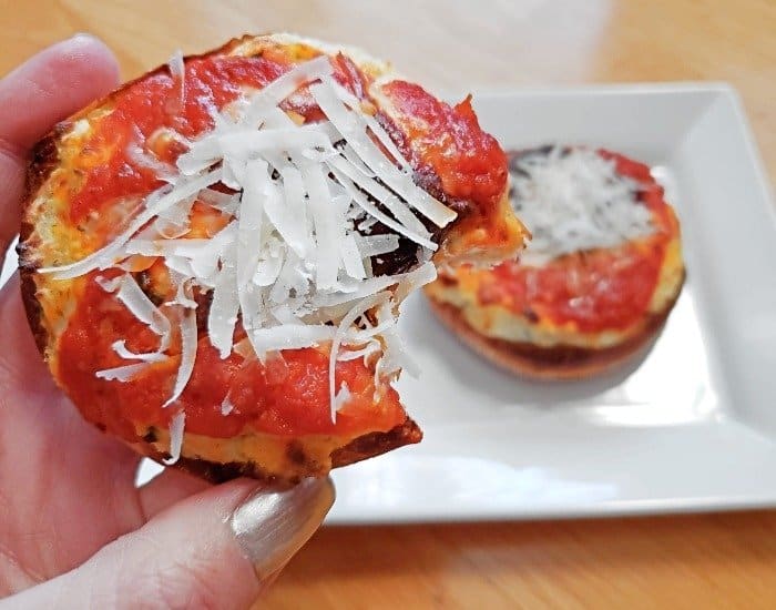 Bite of a mini lasagna pizza