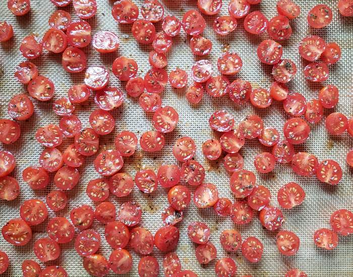 Grape tomatoes on baking sheet