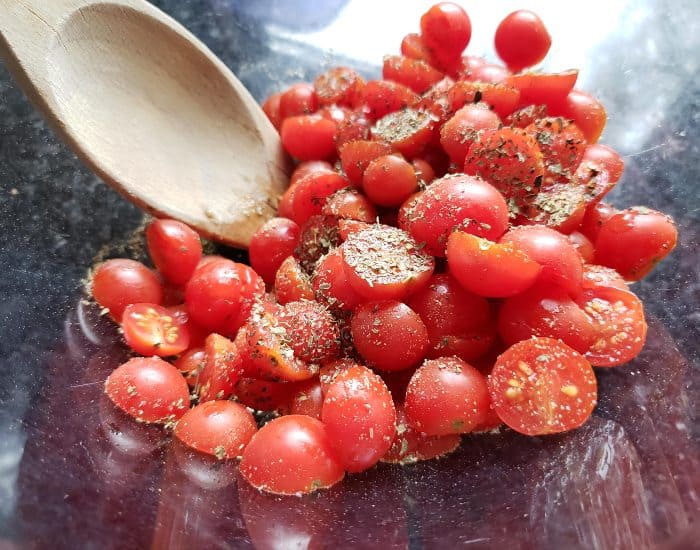 Stir spices and tomatoes