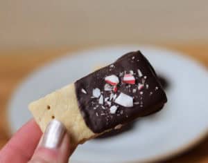 Holding peppermint chocolate dipped shortbread