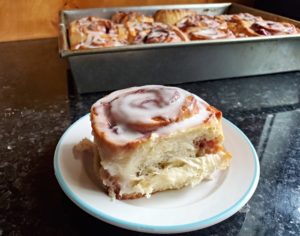 Plate with cherry cinnamon roll