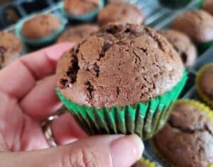 Holding a chocolate zucchini muffin