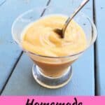 Glass of butterscotch pudding with a spoon