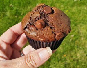 Holding a double chocolate muffin
