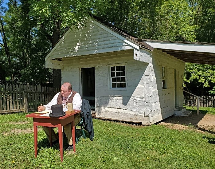 Lawyer sitting in his yard at Conner Prairie