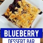 Blueberry Crumble bar closeup on a white plate.
