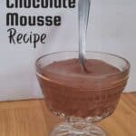 Dish of chocolate mousse with a spoon sticking in it.