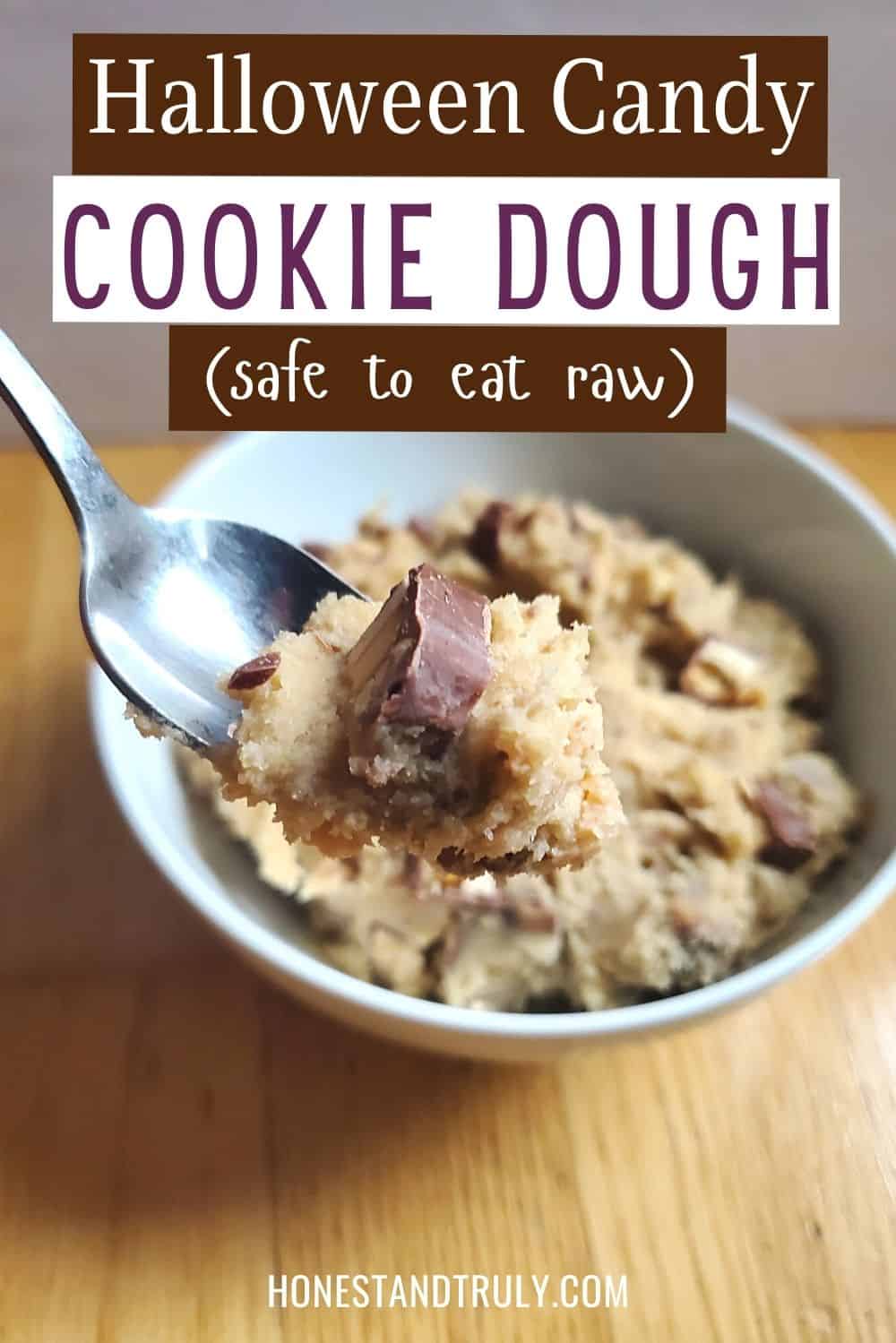 Closeup of a spoon of cookie dough with text Halloween candy cookie dough safe to eat raw.