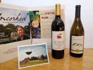 Two wine bottles with information to the left of them.