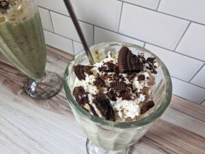 Image shows aNear overhead of copycat shamrock mcflurry with a spoon.