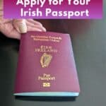 Image shows a hand Pushing Irish passport with text how to apply for your Irish passport.