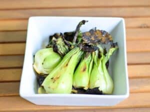 Image shows delicious grilled baby bok choy.