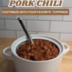 Image shows delicious slow cooker pork chili in a pot with text.