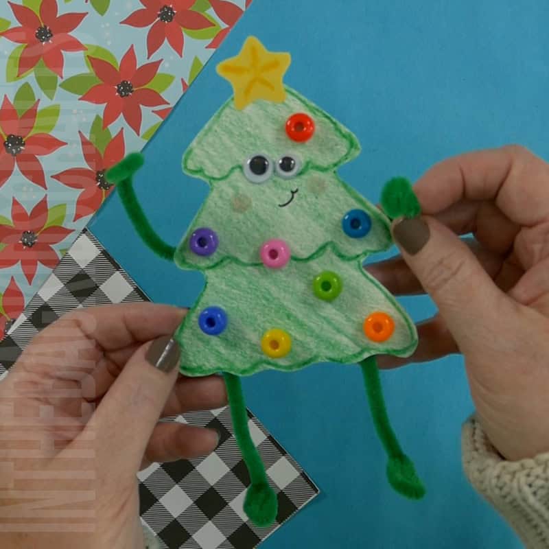 A colorful and festive Christmas tree craft made from simple materials, showcasing an easy craft for kids and a fun Christmas craft project.