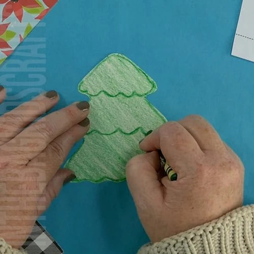 A completed Christmas tree craft made with green paper, colorful beads, pipe cleaners, and a star topper, perfect as an easy craft for kids and a festive Christmas tree craft. step 4 adding detail to the christmas tree 
