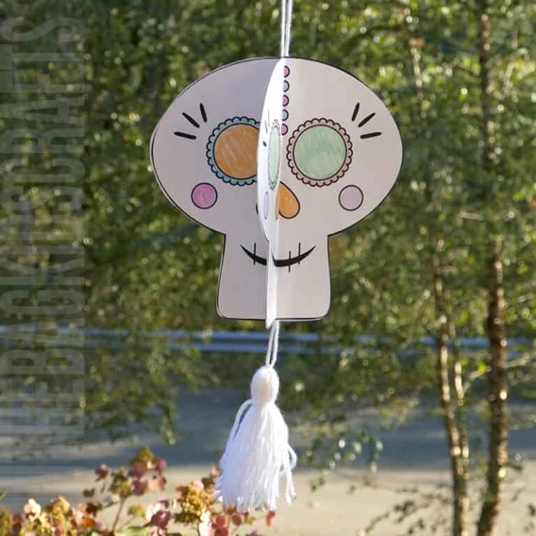 Colorful paper sugar skull craft for kids as a Day of the Dead activity, showcasing a festive and easy DIY decoration for a meaningful Day of the Dead craft.